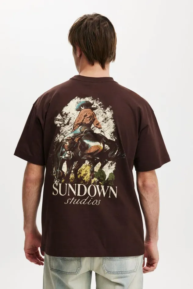 Cotton On Tees and Tanks Box Fit Graphic TShirt Dark Oaksundown Studios 8211 Men Cotton On Tees and Tanks Box Fit Graphic TShirt Dark Oaksundown Studios 8211 Men